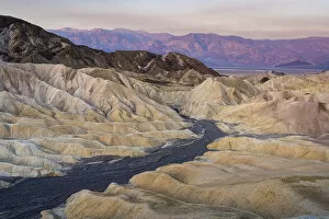 Desolate Gallery: Natural rock formations at Zabriskie Point during sunrise, Death Valley National Park