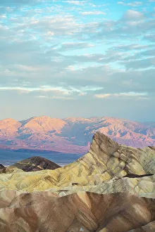 Natural rock formations at Zabriskie Point during sunrise, Death Valley National Park, Eastern California, California, USA