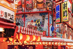 Crowd Prints: Neon lights in the streets of Osaka by night, Japan