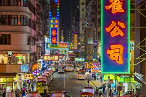Neon lights on Tung Choi Street in Mong Kok at night, Kowloon, Hong Kong, China