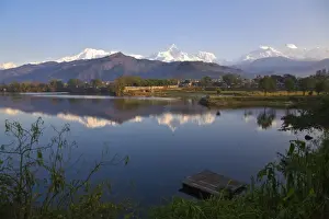 Nepal, Pokhara, Annapurna range reflecting in Phewa Lake