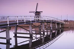 Images Dated 29th July 2016: Netherlands, Kinderdijk, Traditional Dutch windmills and bridge, dusk