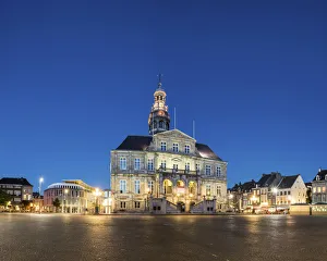 Netherlands, Limburg, Mstricht. Stadhuis city hall on Markt square at dusk