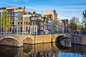 Netherlands, North Holland, Amsterdam. Canal houses at the intersection of Keizersgracht