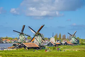 Netherlands, North Holland, Zaandam. Historic windmills and houses in the village