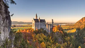 Neuschwanstein Castle in Autumn at sunset Europe, Germany, Bavaria, southwest Bavaria