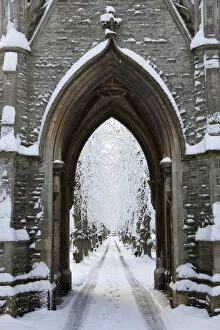 Newark, UK. The central path and victorian gothic lychgate at Newark cemetery
