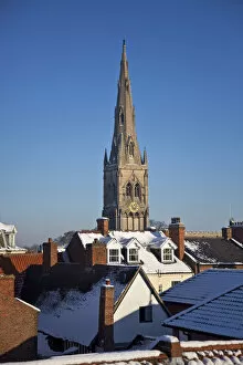 Newark, UK. The Church of St Mary Magdalene rises above Newarks eclectic roofscape