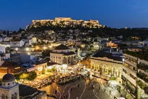 Night city skyline with Monastiraki square and Acropolis in the background, Athens