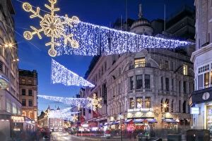 Night view of Christmas lights at Piccadilly Circus in front of Regent Street, London
