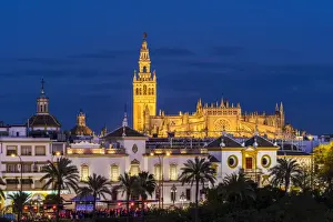 Night view of city skyline with Cathedral and Giralda bell tower, Seville, Andalusia