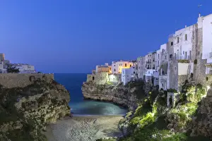 Bari District Prints: Night view of the cove Lama Monachile Cala Porto of Polignano a Mare. Bari district