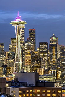 Night view over downtown skyline with the iconic Space Needle in the foreground, Seattle, Washington, USA