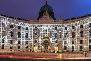 Hofburg Prints: Night view of Michaelerplatz with lights show on the facade of Hofburg Palace, Vienna