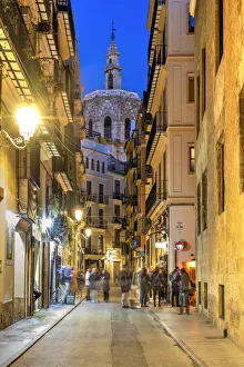 Images Dated 23rd June 2022: Night view of an old towns street with Miguelete Tower in the background, Valencia, Spain