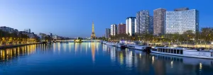 Paris Prints: Night view of River Seine with high-rise buildings on the Left Bank, and Eiffel Tower