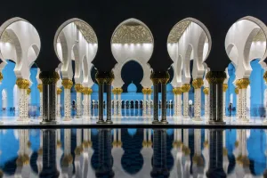 Night view of Sheikh Zayed Mosque reflected in the pool, Abu Dhabi, United Arab Emirates Night view of Sheikh Zayed Mosque reflected in the pool, Abu Dhabi, United Arab Emirates