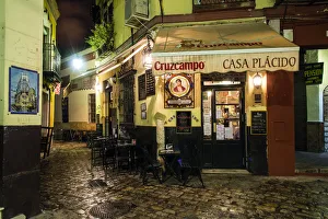 Rainy Prints: Night view of a street in barrio Santa Cruz, Seville, Andalusia, Spain