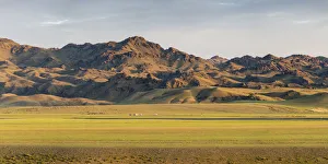 Nomadic Prints: Nomadic camp with livestock and mountains in the background. Bayandalai district