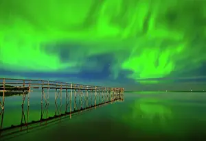 Mystical Prints: Northern lights (aurora borealis) reflected in Lake Winnipeg Matlock, Manitoba, Canada