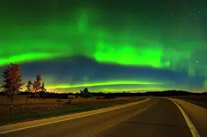 Mystical Prints: Northern lights or aurora borealis and road Birds Hill Provincial Park, Manitoba, Canada