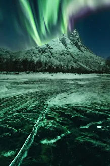 Northern lights over Mount Otertinden in the Tromso region, Norway Northern lights over Mount Otertinden in the Tromso region, Norway