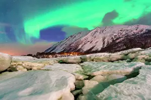 Aurora Borealis Prints: Northern Lights over snowcapped mountains and fjord surrounding Oldervik