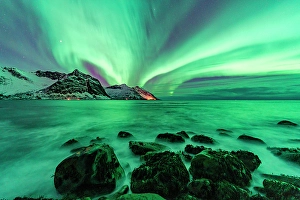Aurora Borealis Prints: Northern Lights over snowcapped mountains and the rough sea