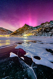 Dramatic Sky Prints: Northern Lights over the village of Montespluga and frozen lake