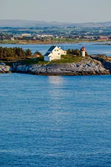 Stavanger Prints: Norway, Rogaland, Mekjarvik, Houses and a small lighthouse at the entrance of