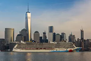 Norwegian Cruise Line ship passing through Hudson River with Lower Manhattan financial