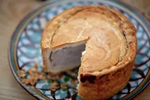 Youth Prints: Nottinghamshire, UK. Melton Mowbray pork pie on handmade ceramic plate