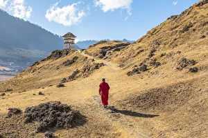 Novice Monk (Child Monk) walking in Phobjikha Valley, Bhutan