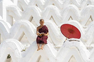 Novice monk reading a book at Hsinbyume pagoda, Mingun, Mandalay, Sagaing Township