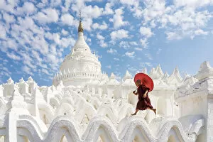 Pagoda Gallery: Novice monk running and jumping at Hsinbyume pagoda, Mingun, Mandalay, Sagaing Township