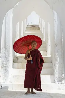 Staircase Prints: Novice monk with an umbrella standing at staircase hallway at Hsinbyume pagoda, Mingun