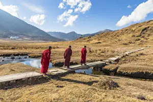 Boys Prints: Novice Monks (Child Monks) crossing a river in Phobjikha Valley, Bhutan