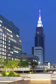Shinjuku Prints: NTT Docomo Yoyogi Building and viewing platform of Shinjuku Station at dusk, Tokyo, Japan