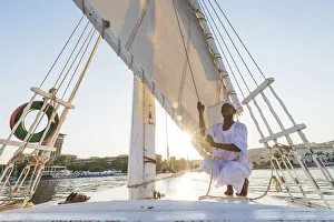 Nubian sailor on his felucca boat on the Nile River, Aswan, Upper Egypt, Egypt, Africa