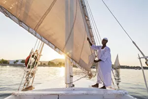 Images Dated 14th May 2020: Nubian sailor on his felucca boat on the Nile River, Aswan, Upper Egypt, Egypt, Africa