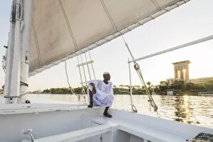 Images Dated 14th May 2020: Nubian sailor on his felucca boat on the Nile River, Aswan, Upper Egypt, Egypt, Africa