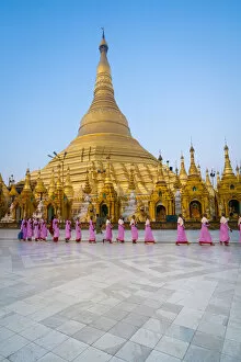 Gold Gallery: Nuns walking by Shwedagon Pagoda, Yangon, Yangon Region, Myanmar