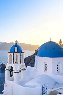 Images Dated 29th July 2021: Oia, Santorini, Cyclades, Greece The famous blue domes of the churches of Oia