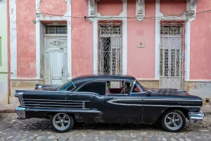 Cobbled Street Prints: Old American car parked on cobbled street, Centro Havana, Havana, Cuba