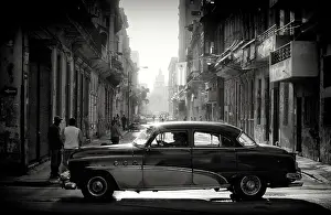 Classic Prints: Old American cars on a street at sunrise, Havana Centro, Havana, Cuba, Caribbean