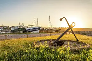Shipwrecks Prints: Old anchor with Cimetiere de Bateaux at the port of Camaret-sur-Mer