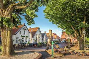Siel Harbor Prints: Old anchor and houses at the harbor of Greetsiel, East Frisia, Lower Saxony, Germany