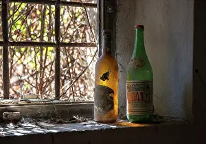 Bottles Prints: Old bottles on window ledge in a derelict farmhouse, Cosona, near Pienza, Tuscany, Italy