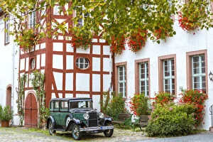 Old classical car in front of traditional building, Rudesheim, Rhine valley, Hesse
