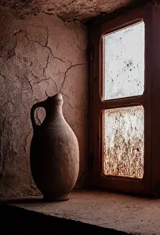 Old clay pot on a window ledge inside 17th century Kasbah Amridil, Skoura, Morocco